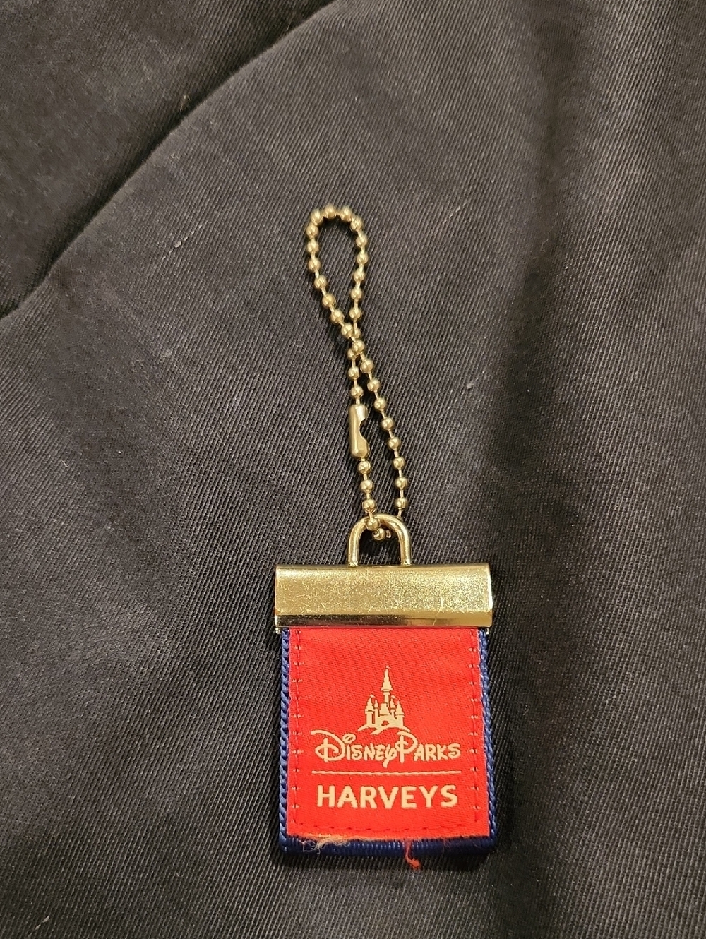 Disney Parks Harveys Seatbelt Bag Charm Hang Tag Red Blue
